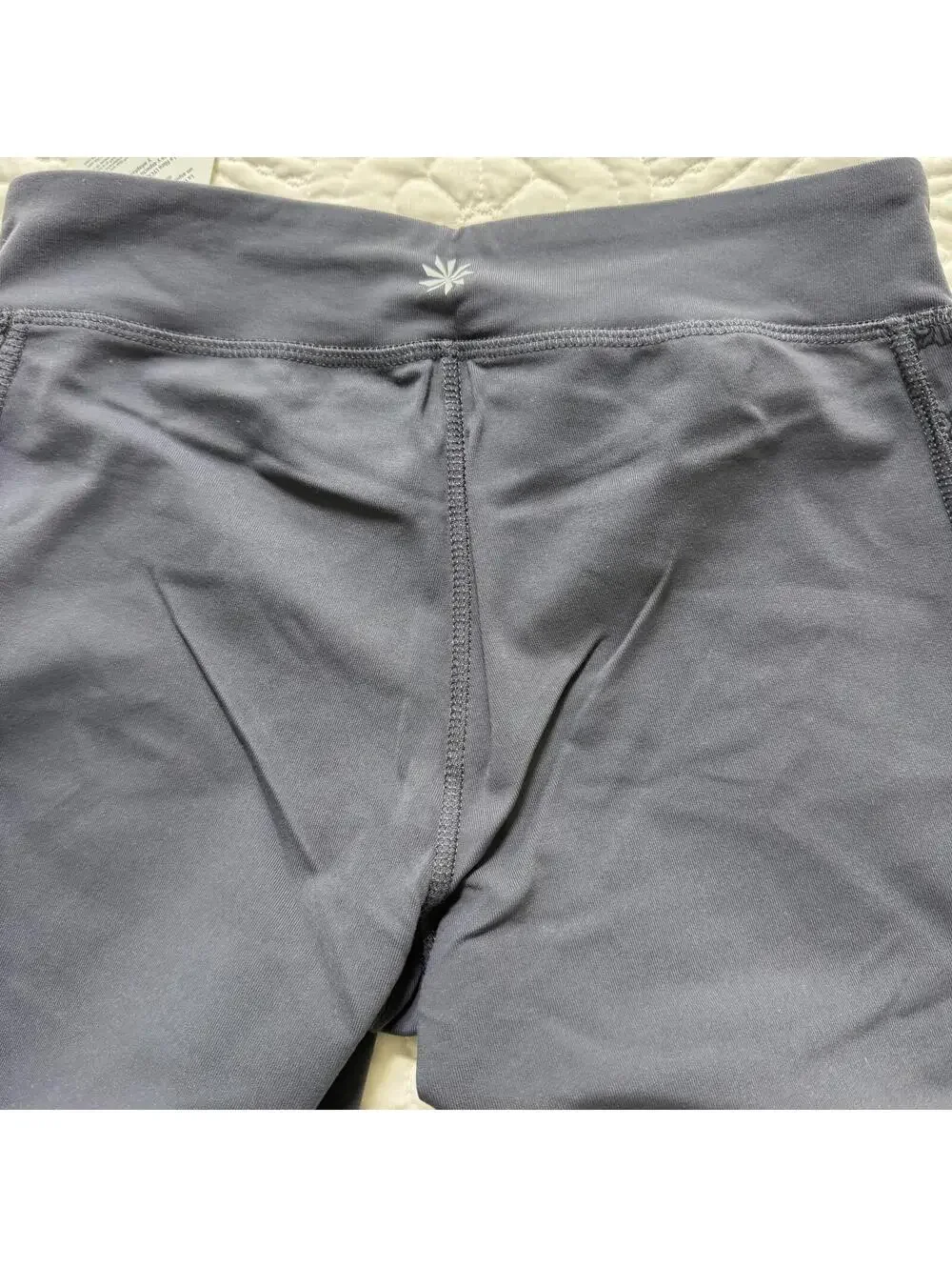 ATHLETA SZ S Elation GRAY Capri Legging Flower motif on Leg Crossover Waist NWT